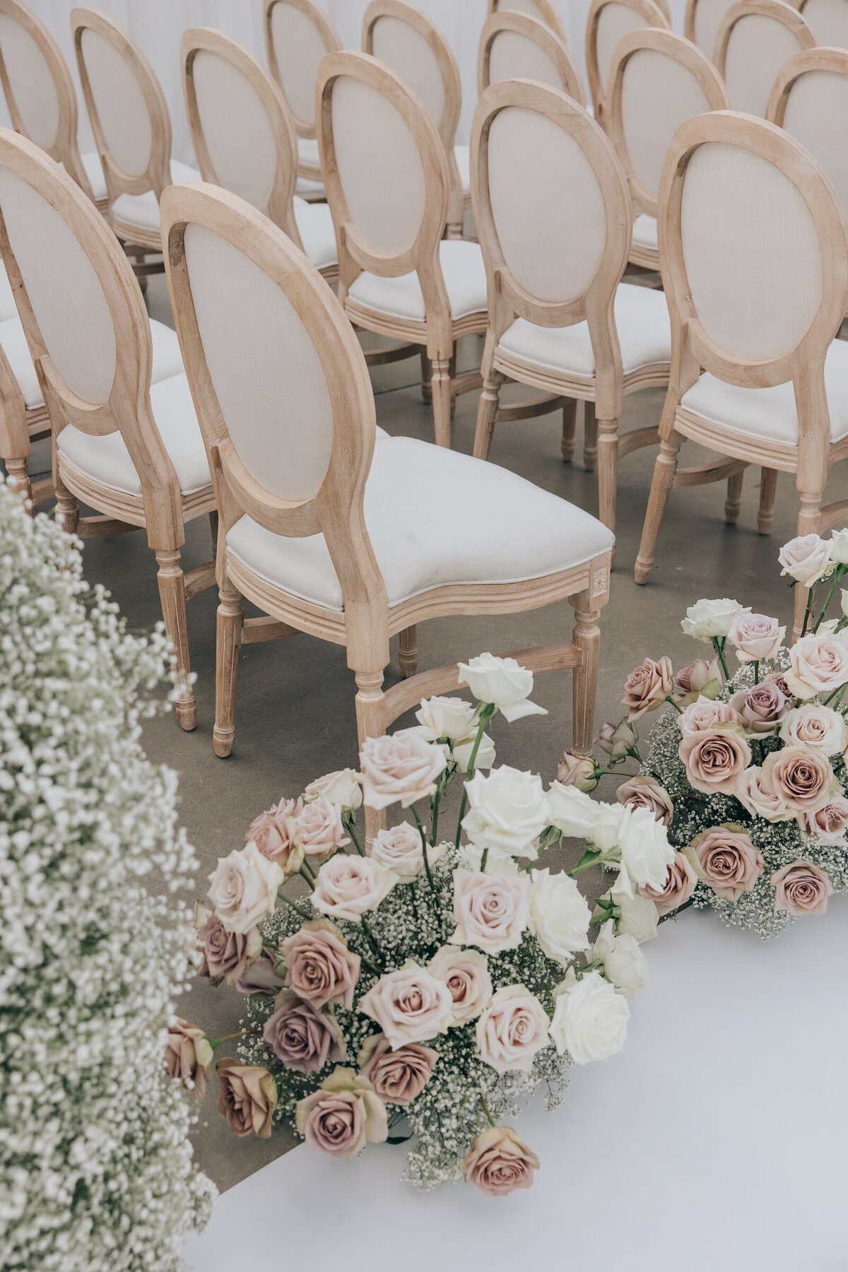 Rose filled ivory and  lavender themed wedding reception