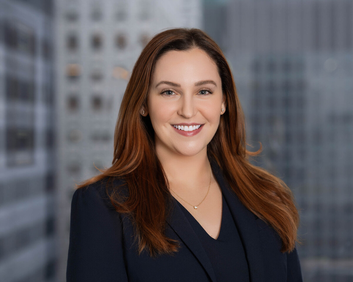 Indoor corporate headshot of woman in blue blazer by Jennifer Lee