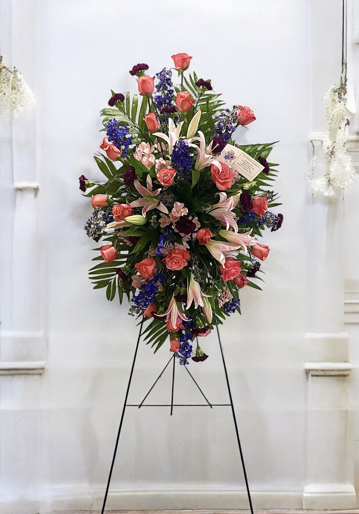 side arrangement for a funeral  made by Bud Blooms and Blossoms