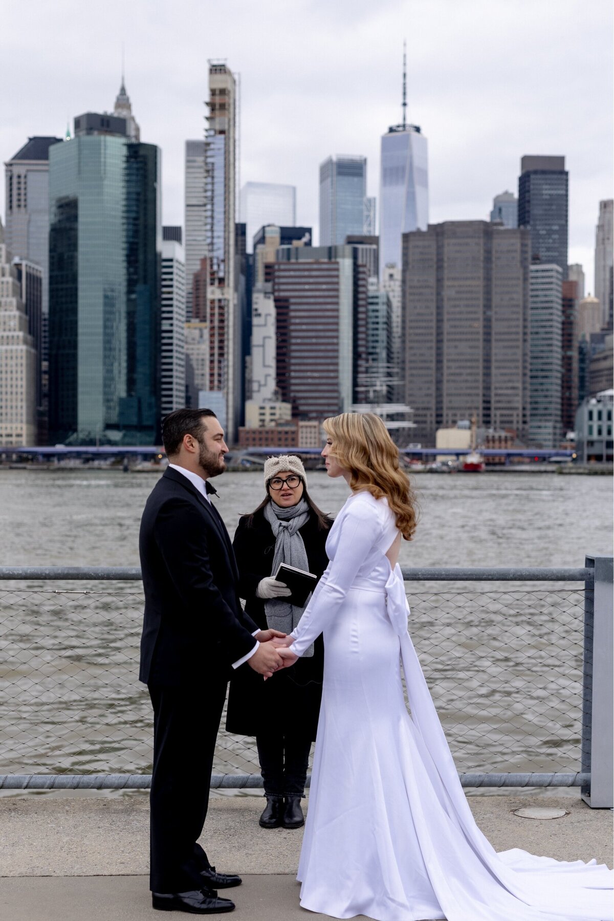 Bride and groom saying 'I DO' in front of river in NYC.
