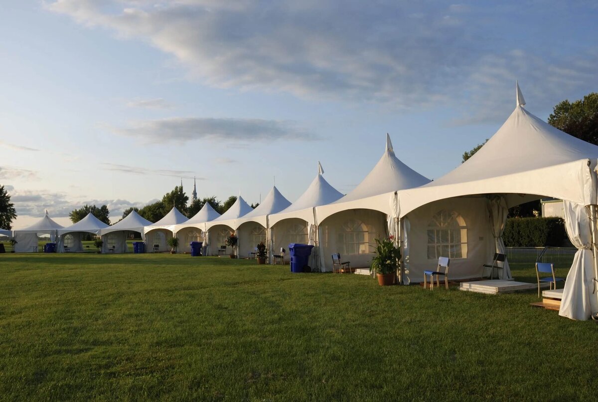 A long row of Pagoda marquees in a field