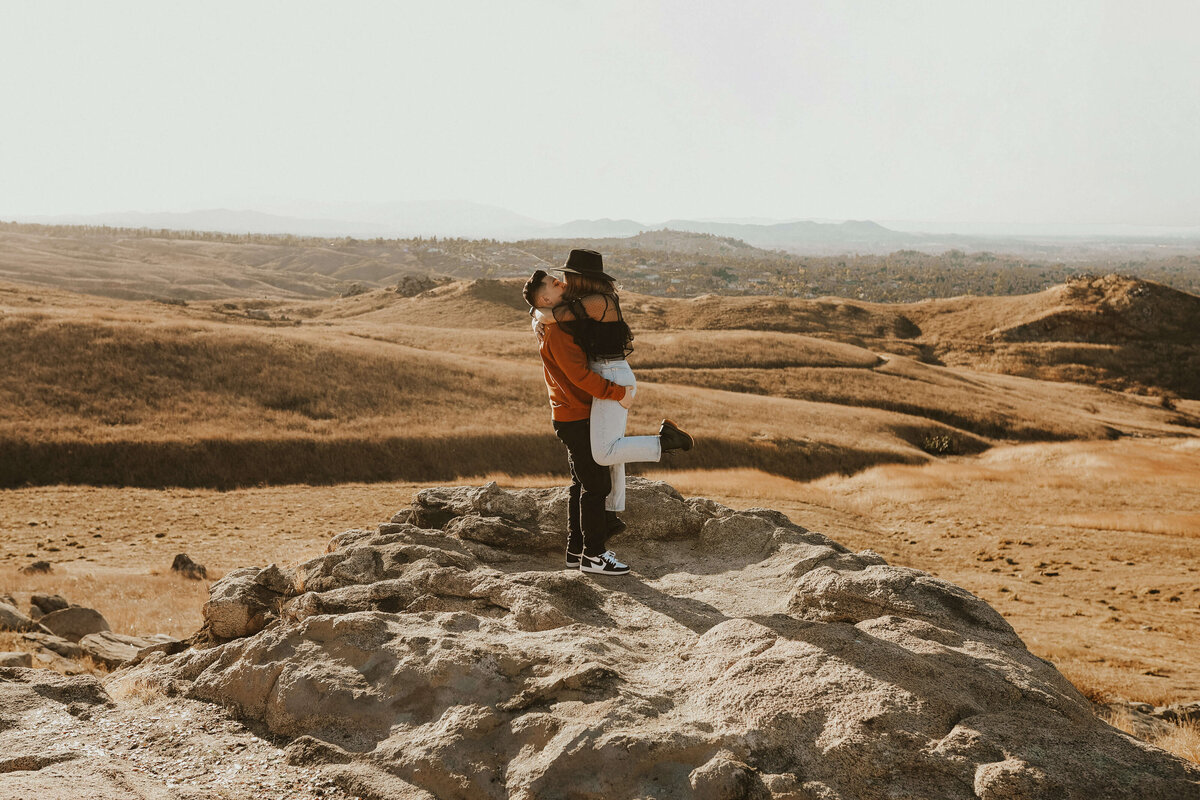 couple-open-field-views-wild-adventurous