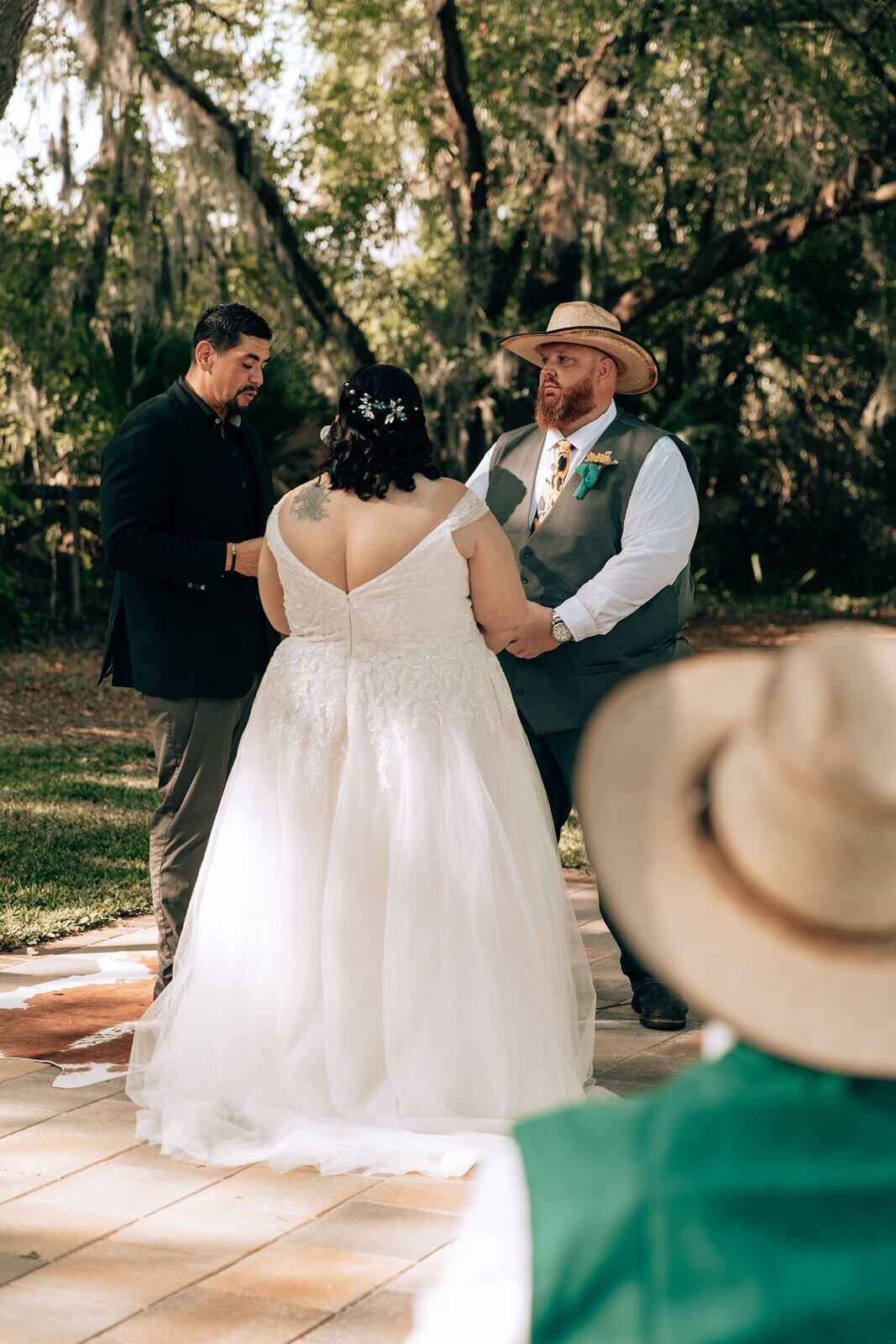 bride and groom stand at the alter during ceremony at the farmhouse on 44