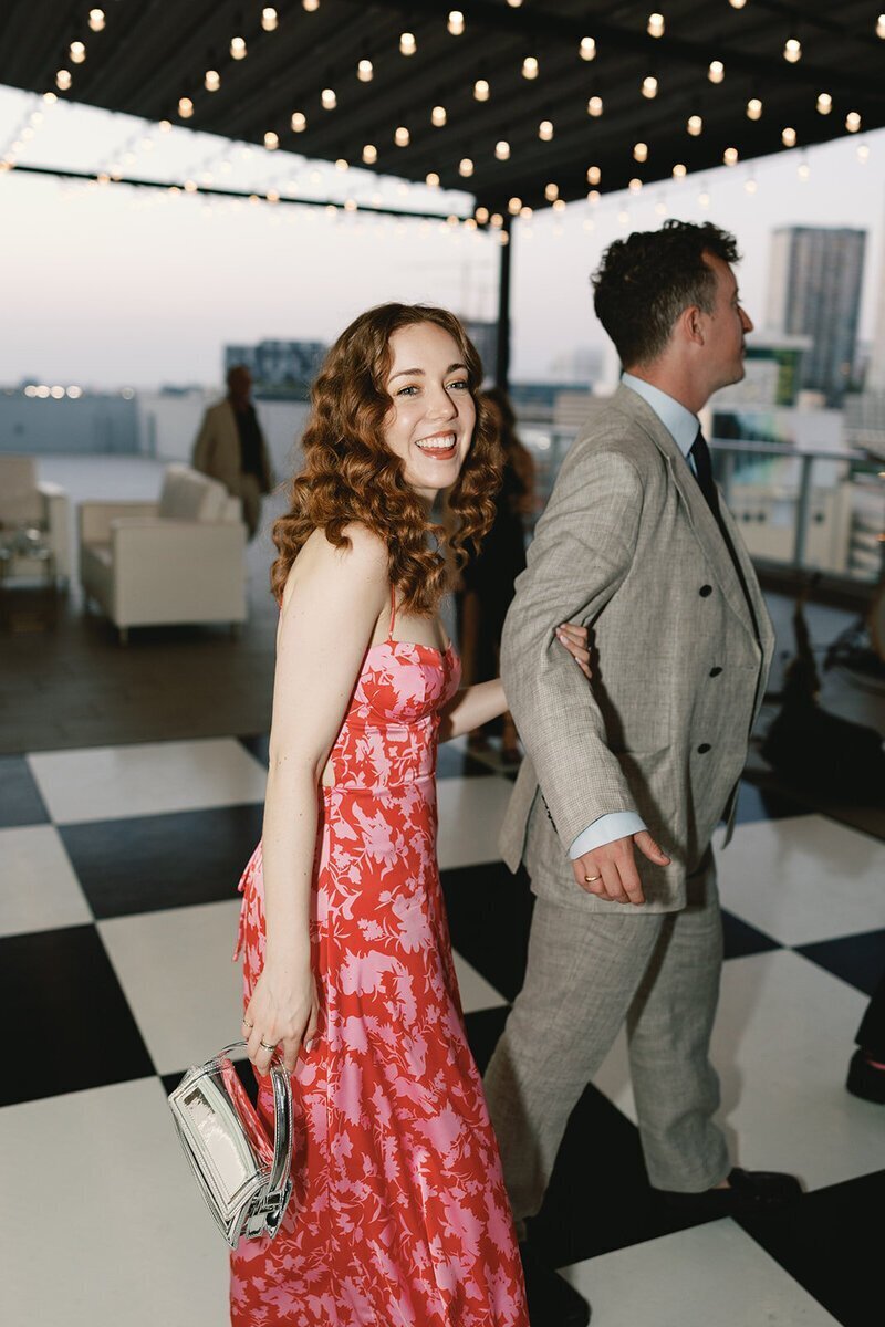 wedding guests walking across dance floor at penthouse at riverside wharf wedding
