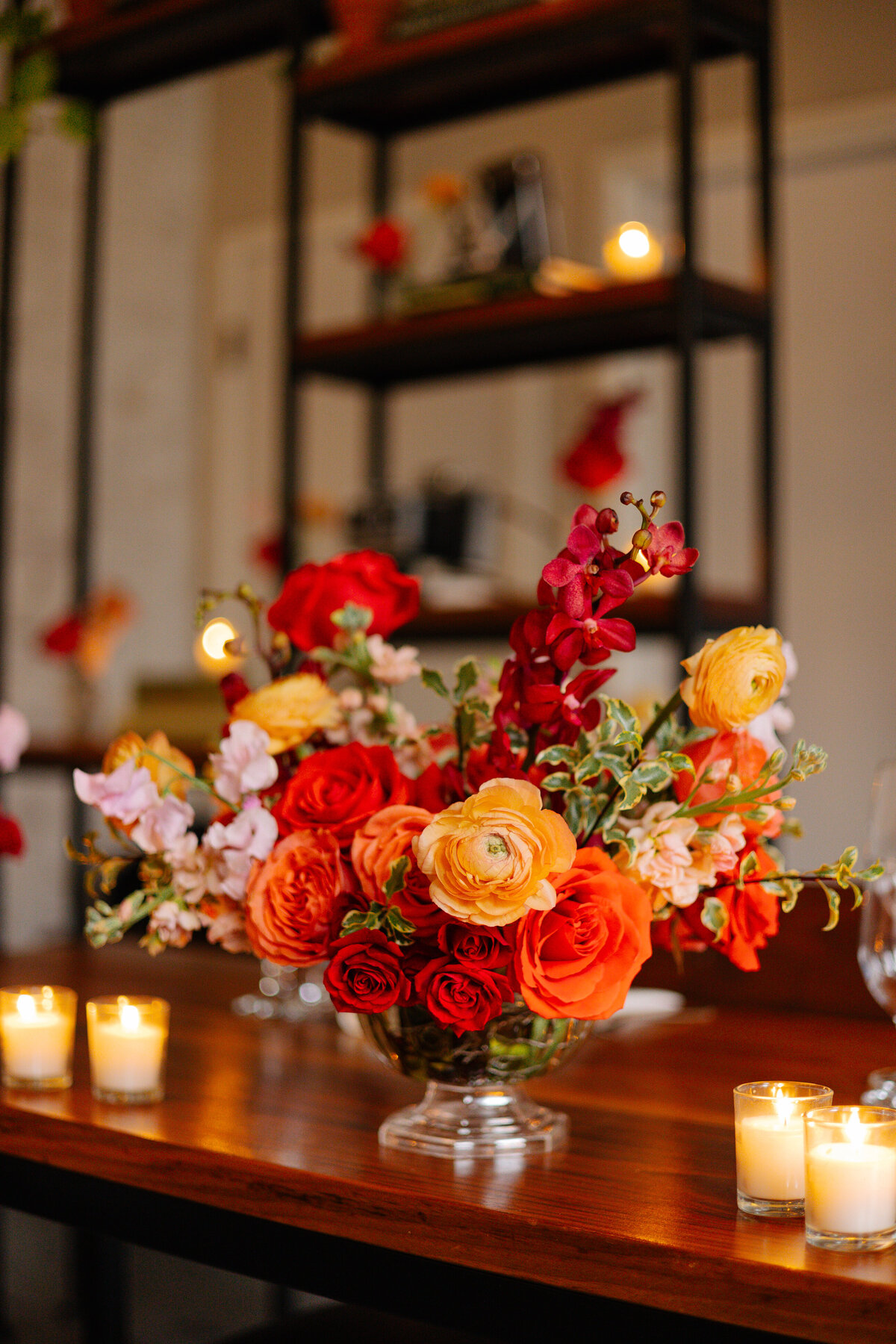 bursting bright red and orange flower arrangement