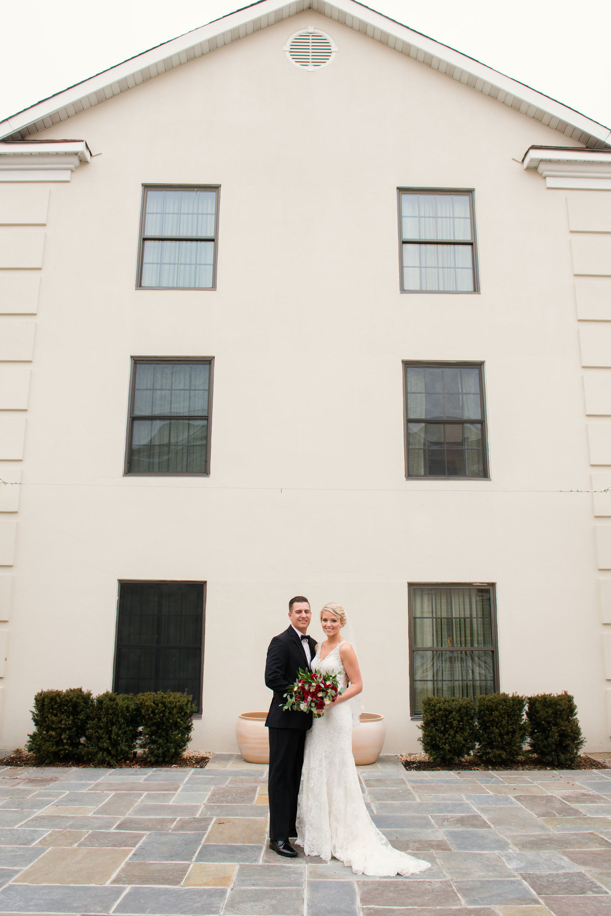 Bride and groom outside The Inn at Fox Hollow