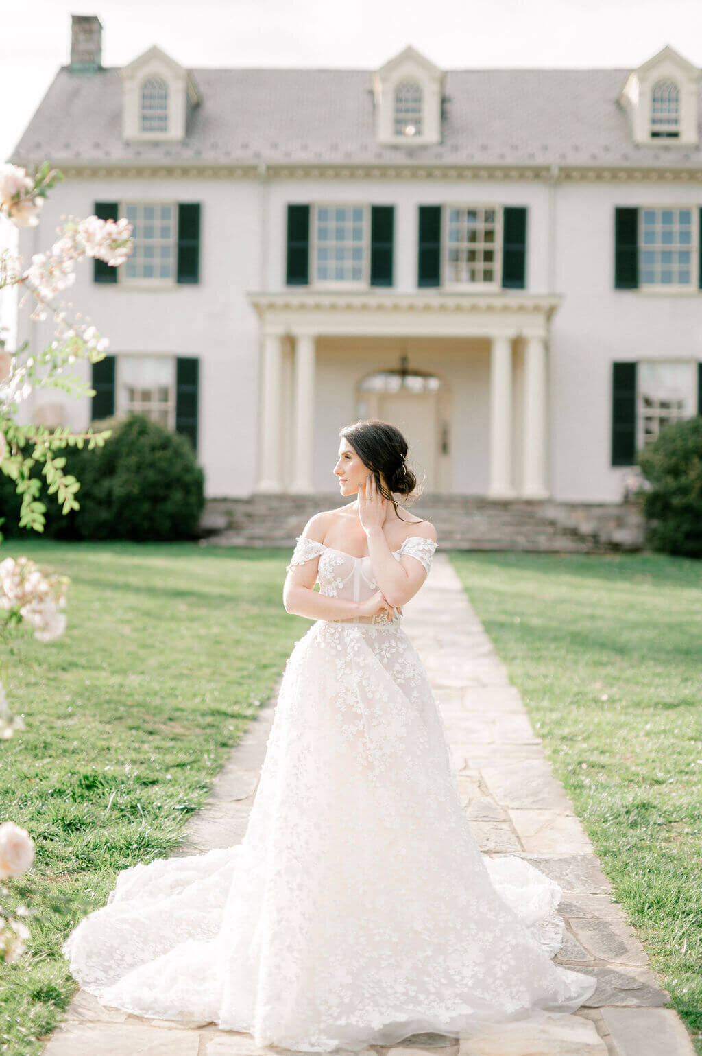Bridal wedding photos of bride in front of Rust Manor House