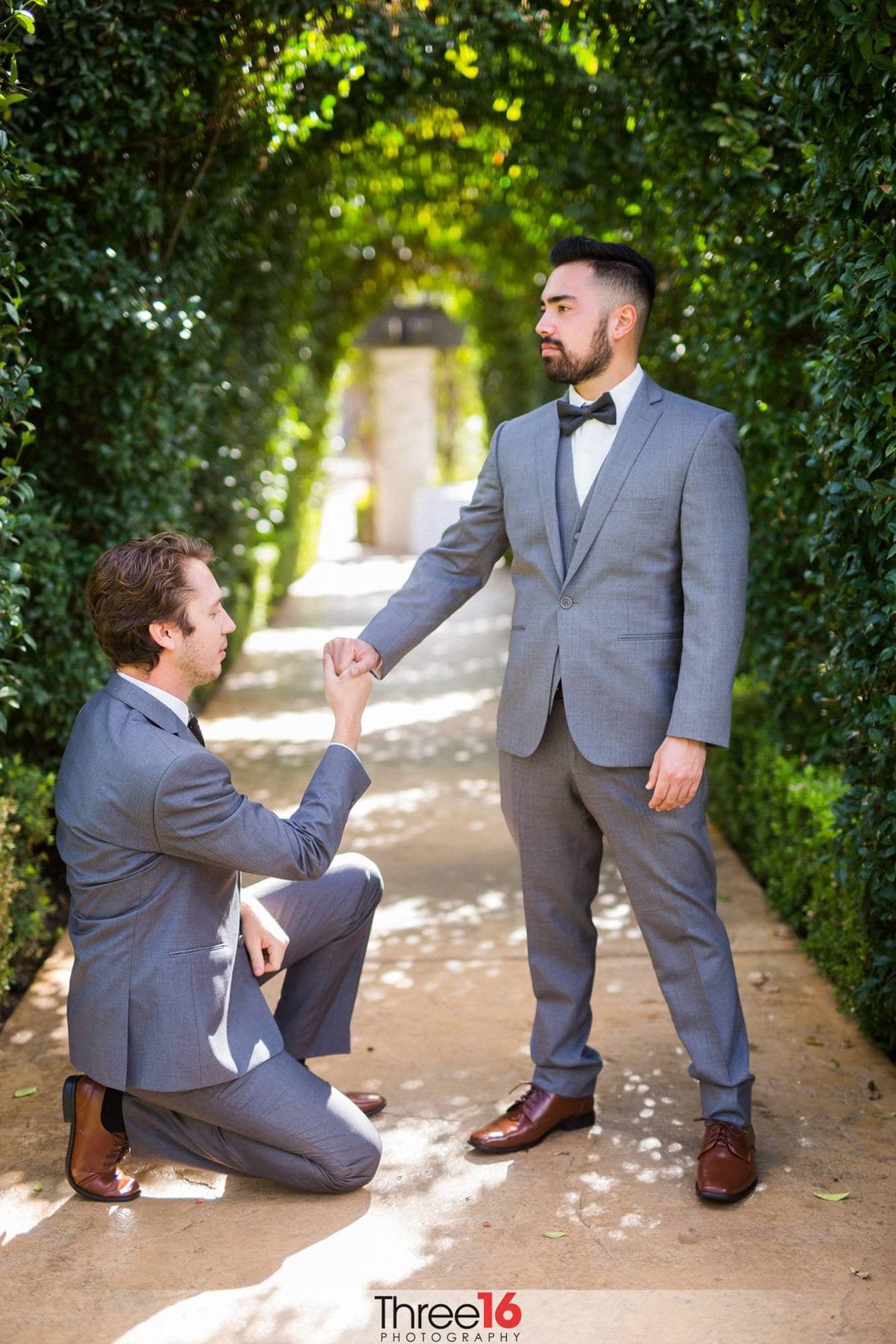 Groom playfully proposes to a Groomsman