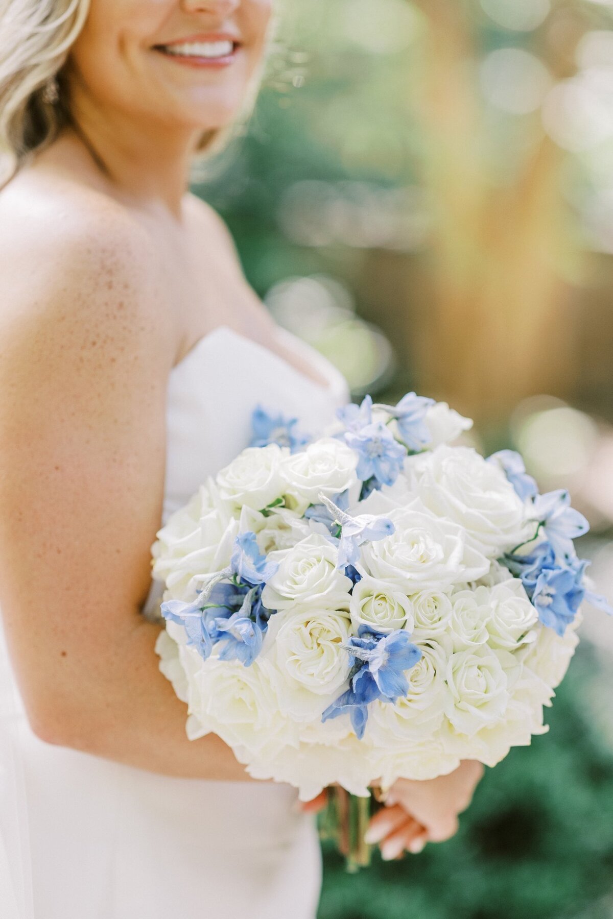 Bridal bouquet with white and blue flowers