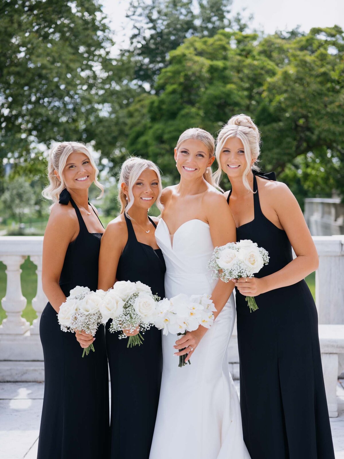 Bride with bridesmaids in black and white at Cleveland Art Museum