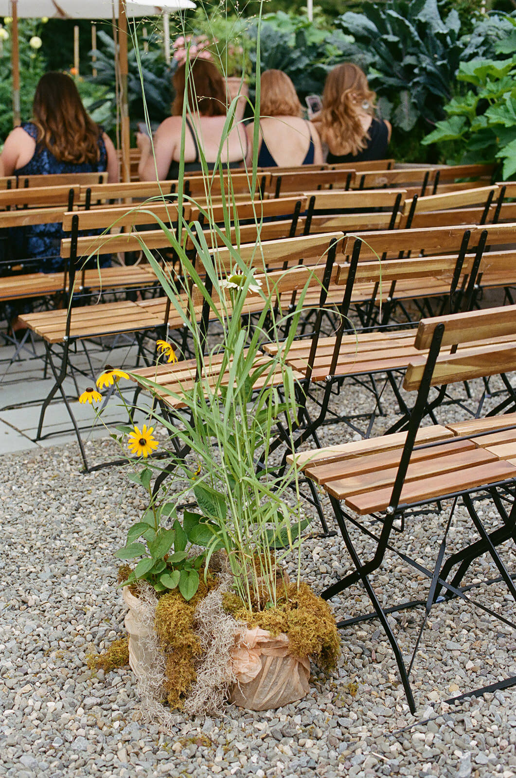 garden-flowers-moss-line-wedding-ceremony-aisle