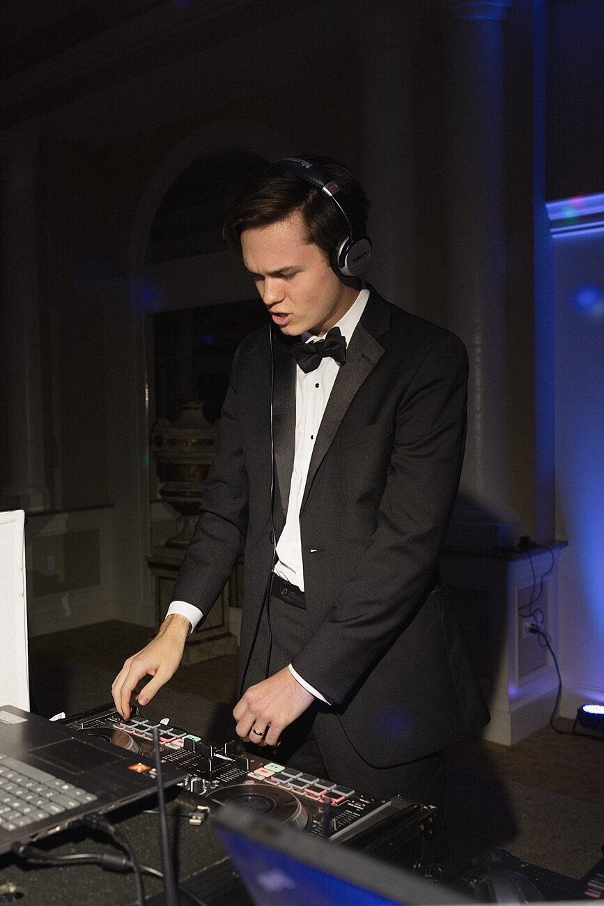 groom dj-ing at reception