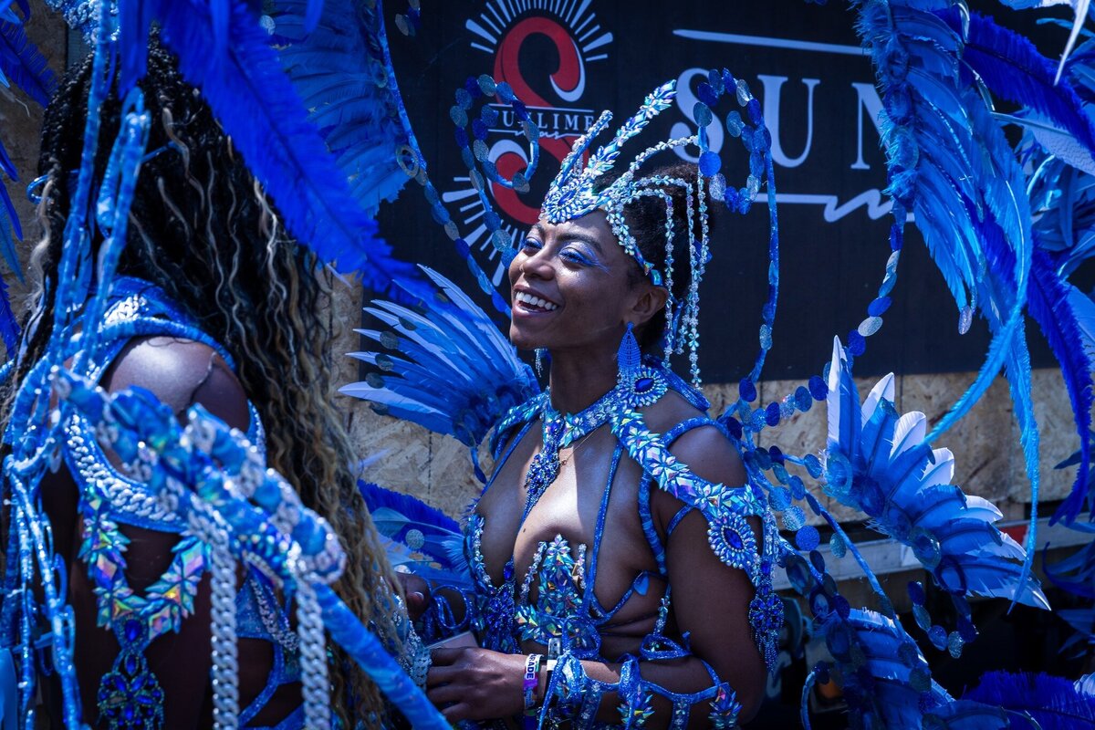 Toronto caribbean carnival parade masquerader in costume with Sunlime Mas, the number 1 medium size band at Toronto Carnival.
