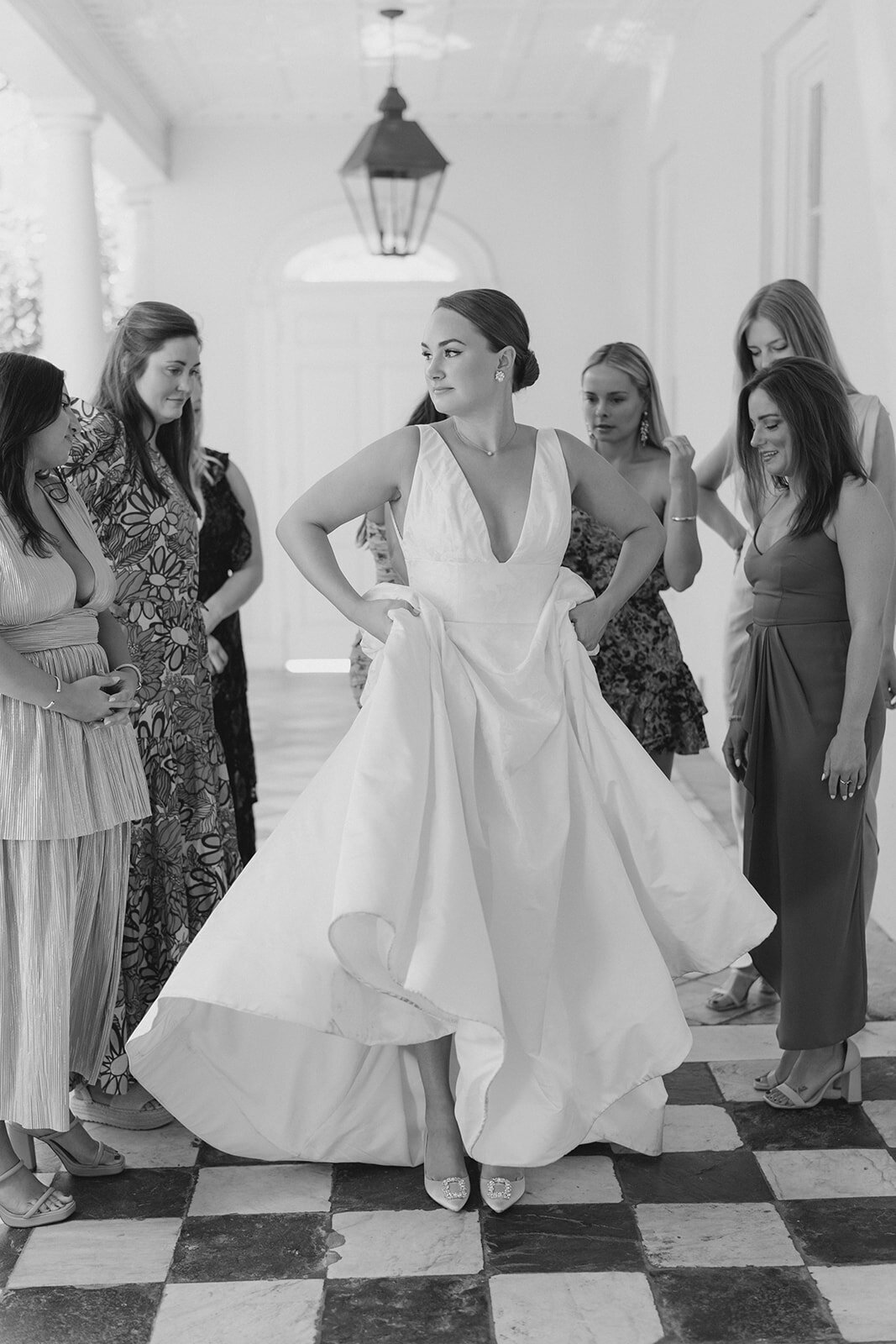 bride_first_look_with_friends_black_and_white_william_aiken_house_outdoor_charleston_destination_wedding_kailee_dimeglio_photography_east_coast_destination_wedding_photographer-374_websize
