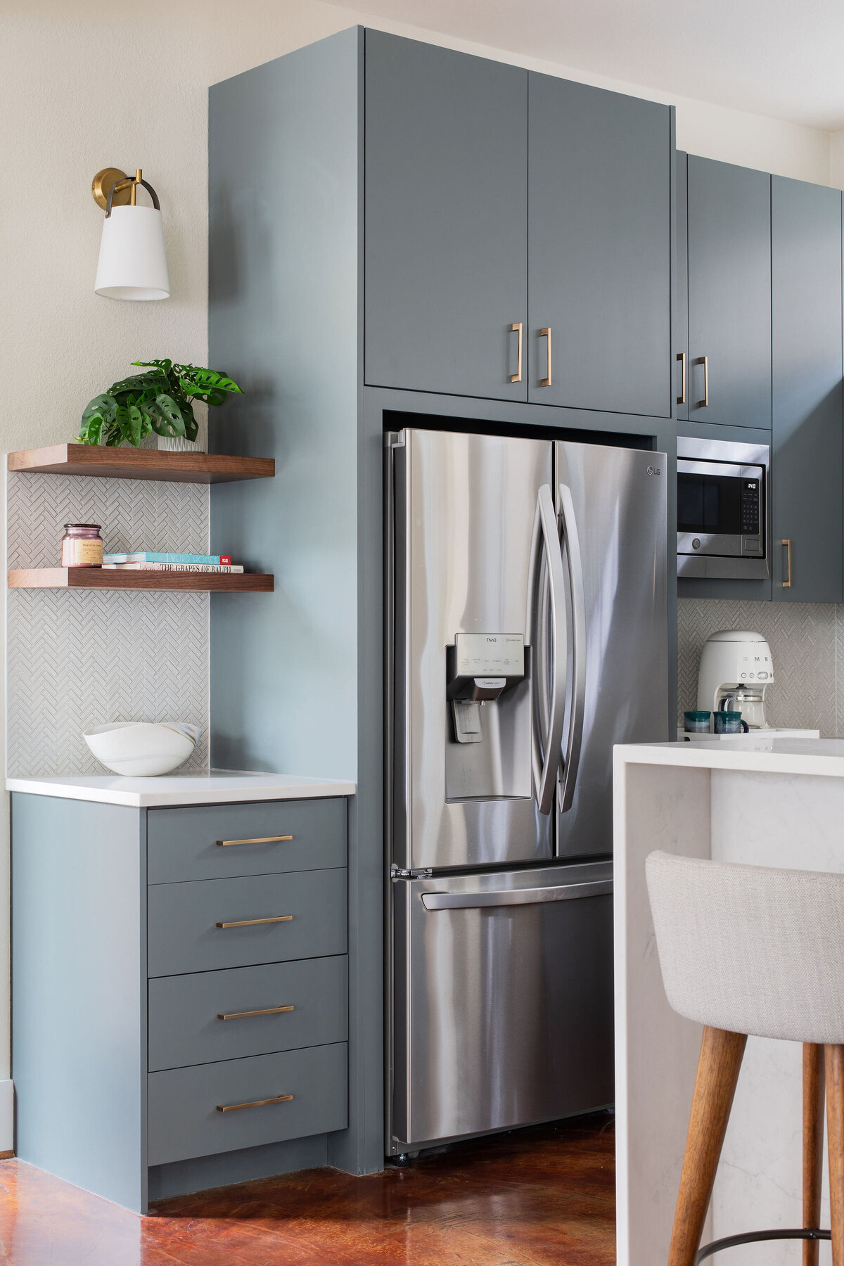 hello-home-Contemporary-Kitchen-Blue-Cabinets-Brass-Hardware-Stainless-Steel-Appliances-Polished-Concrete-Floor-Kitchen-Remodel-quartz-waterfall-island-Austin-TX-3