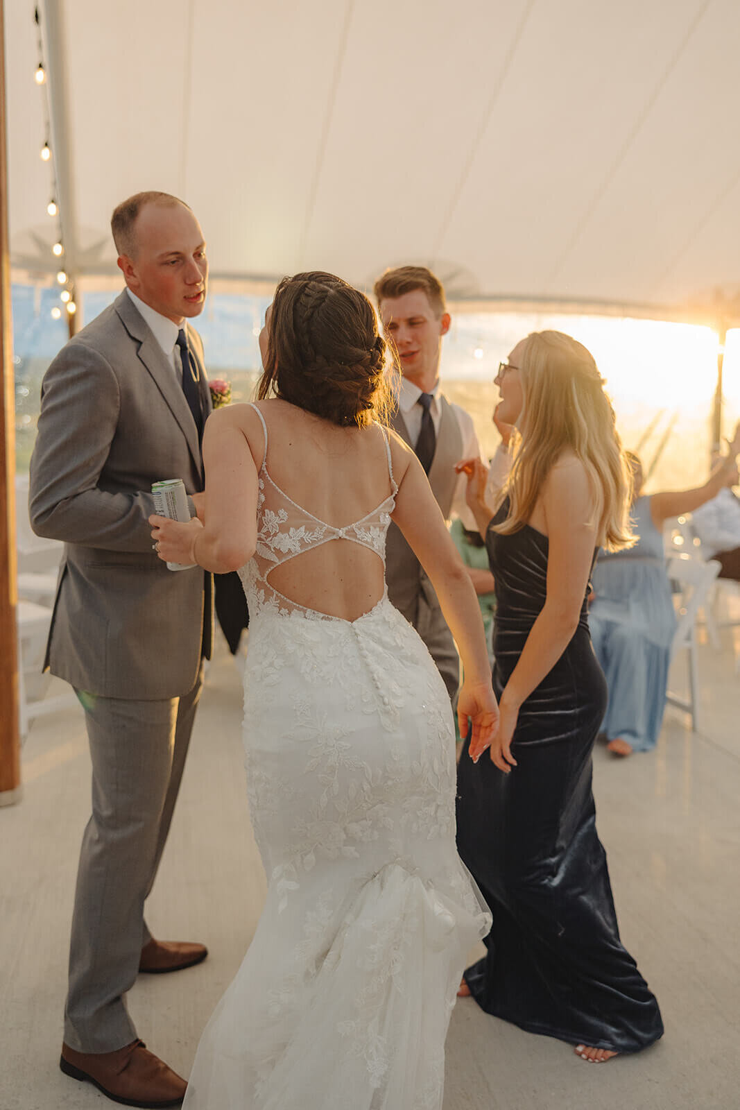 Bride chatting to wedding guests at Finger Lakes wedding reception at Seneca Ridge on Seneca Lake Fingerlakes, NY