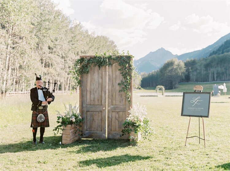 Custom photo backdrop for wedding guests at an outdoor venue
