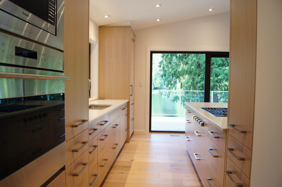 Modern kitchen design in light wood cabinetry.
