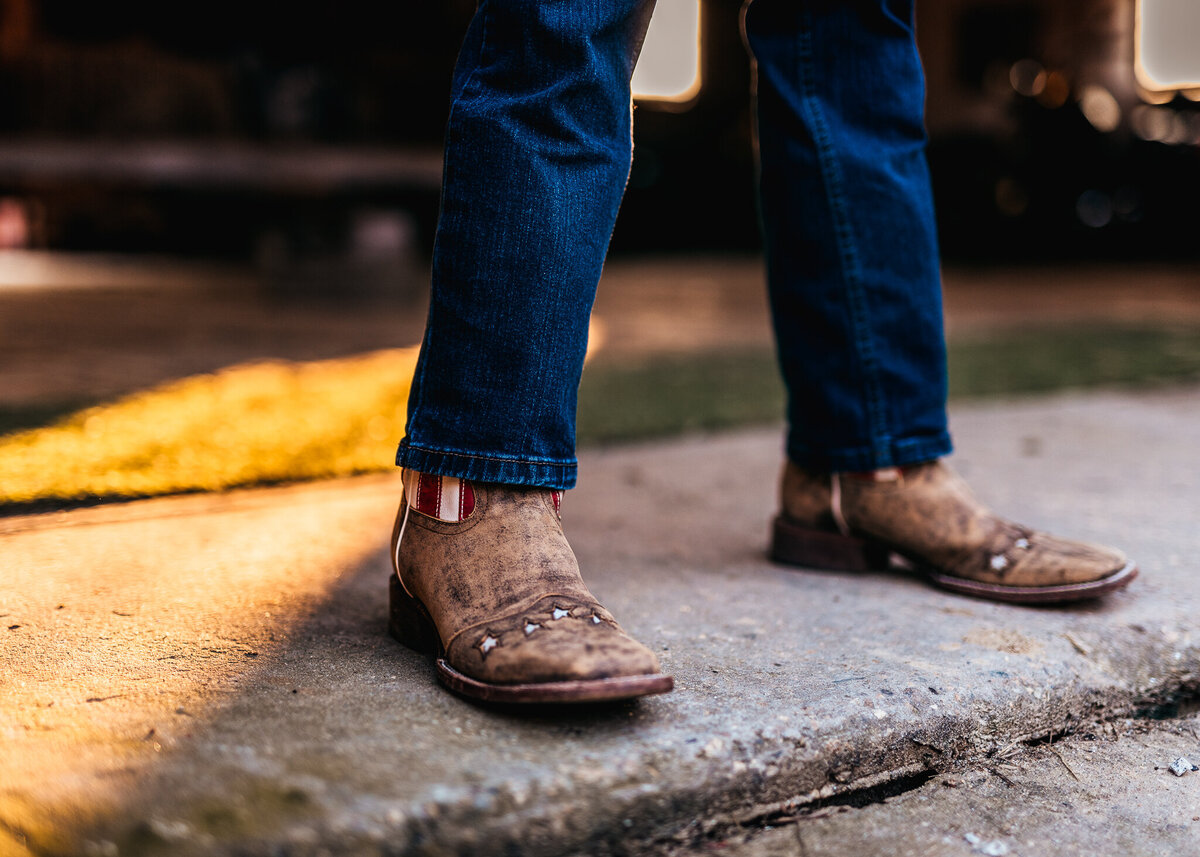 Detail photo of high school seniors cowboy boots by lisa smith photography