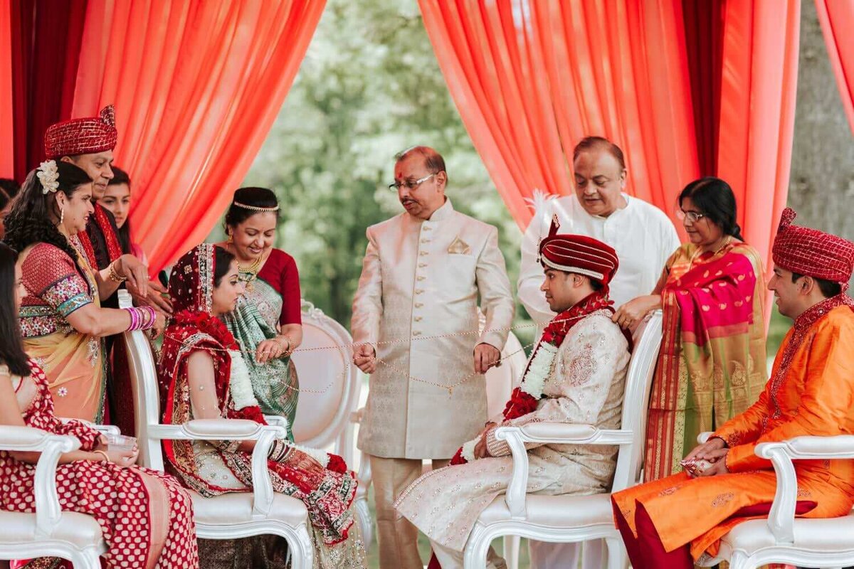 Bride and groom in a ceremony surrounded by friends and family in Deerfield country.