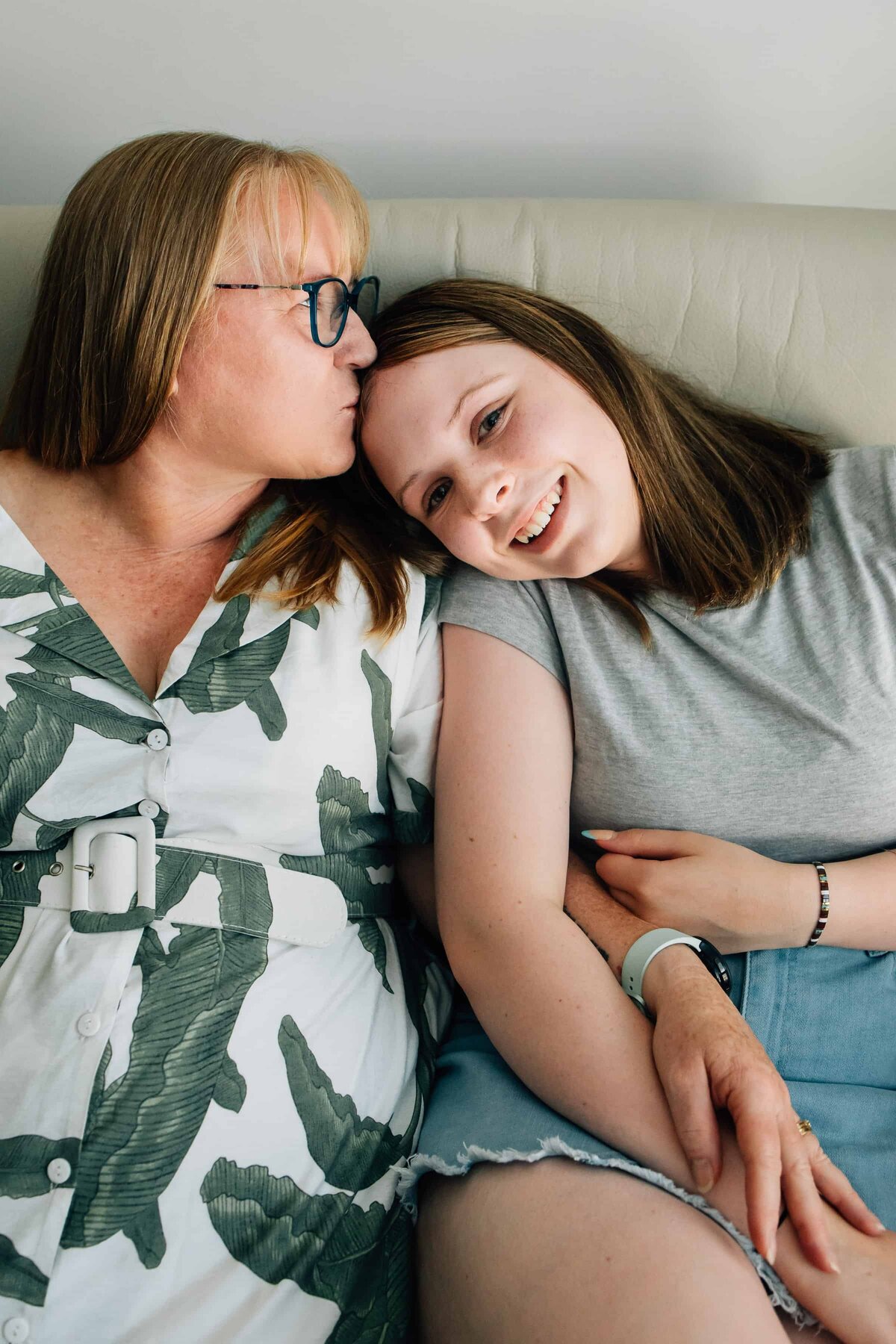 Mum kissing forehead of teenage daughter, Family Photography Gift Vouchers Melbourne