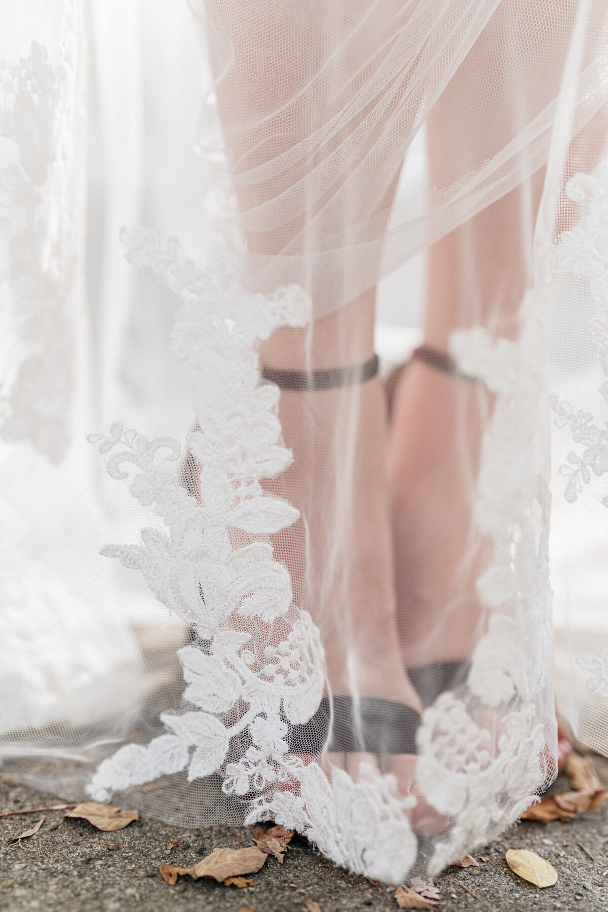 closeup of bridal gown and shoes