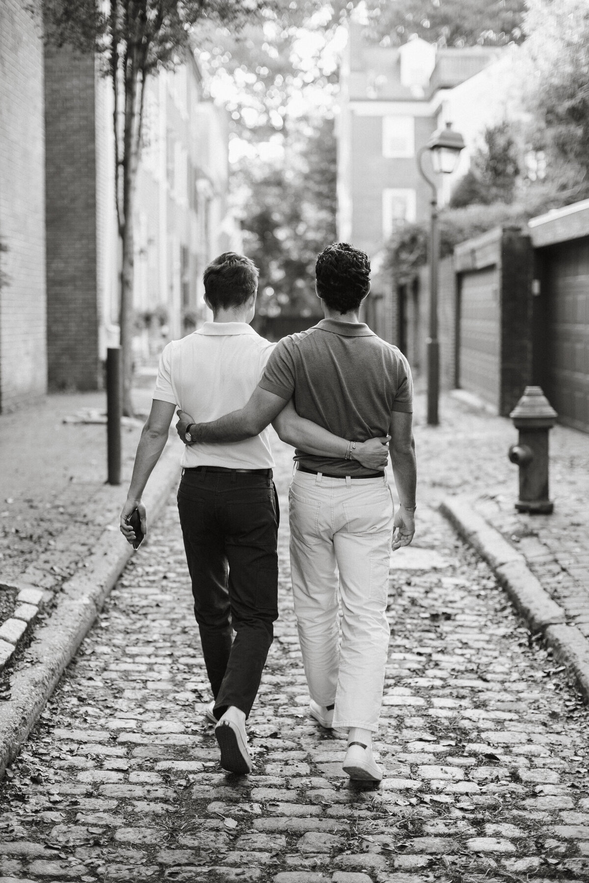 lgbtq couple walking during south philly engagement photos