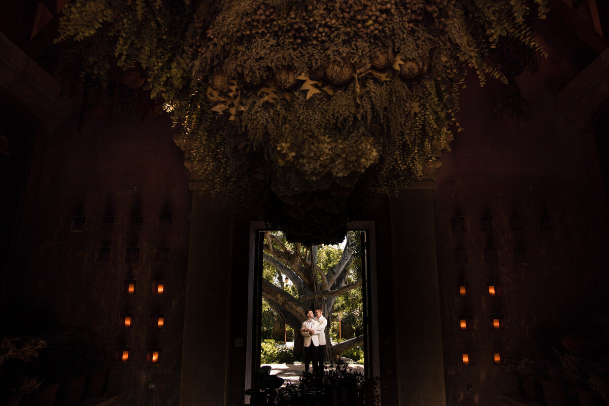 A couple poses at the RItz Dorado beach spa  at a destination wedding in Puerto Rico
