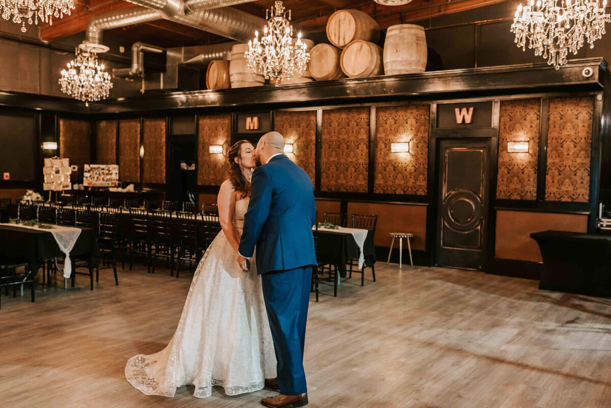 Bride and groom kiss at the first look. 