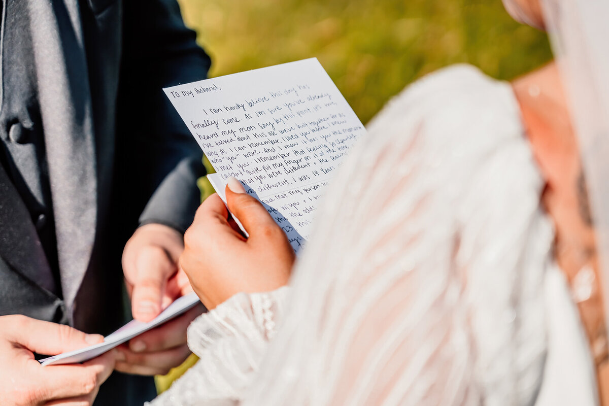 close up details of a brides vows to her husband