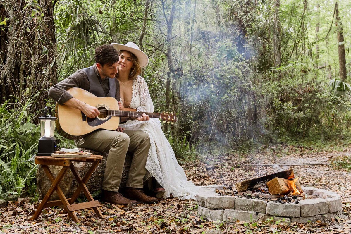 68-groom-playing-guitar-campfire