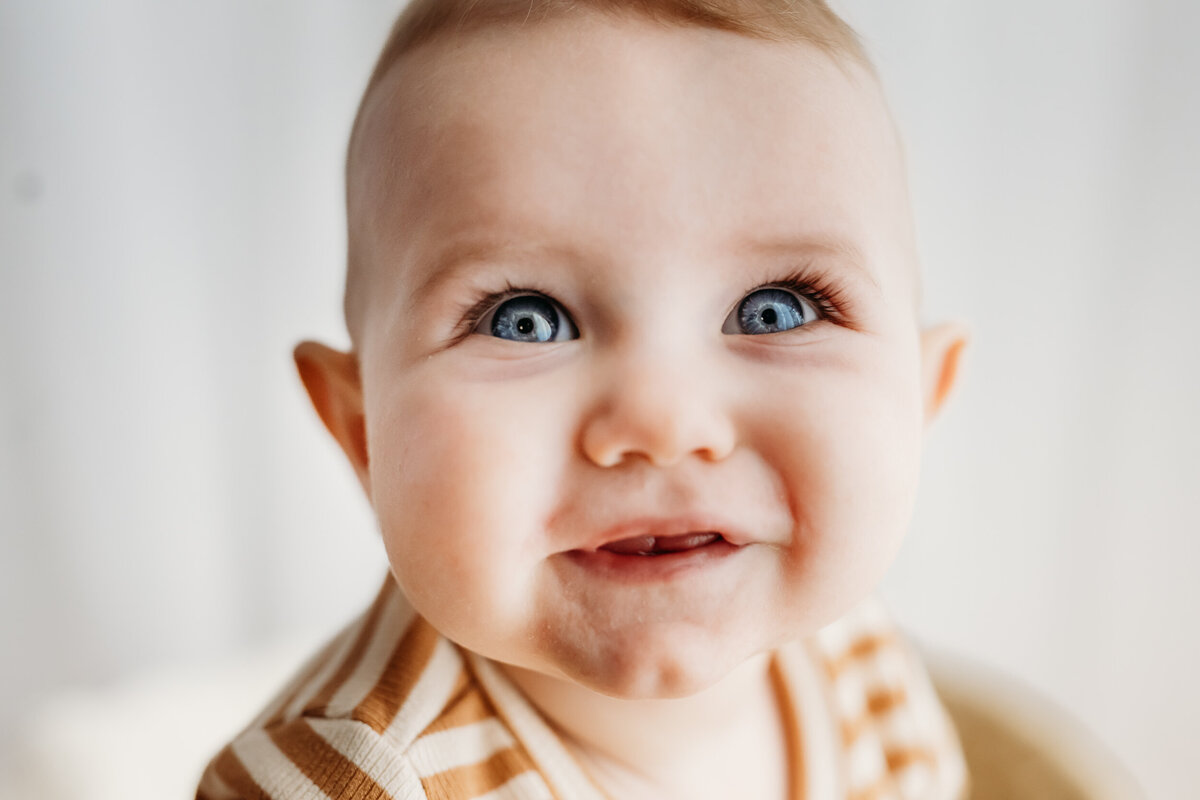 close up photo of a baby's bright blue eyes