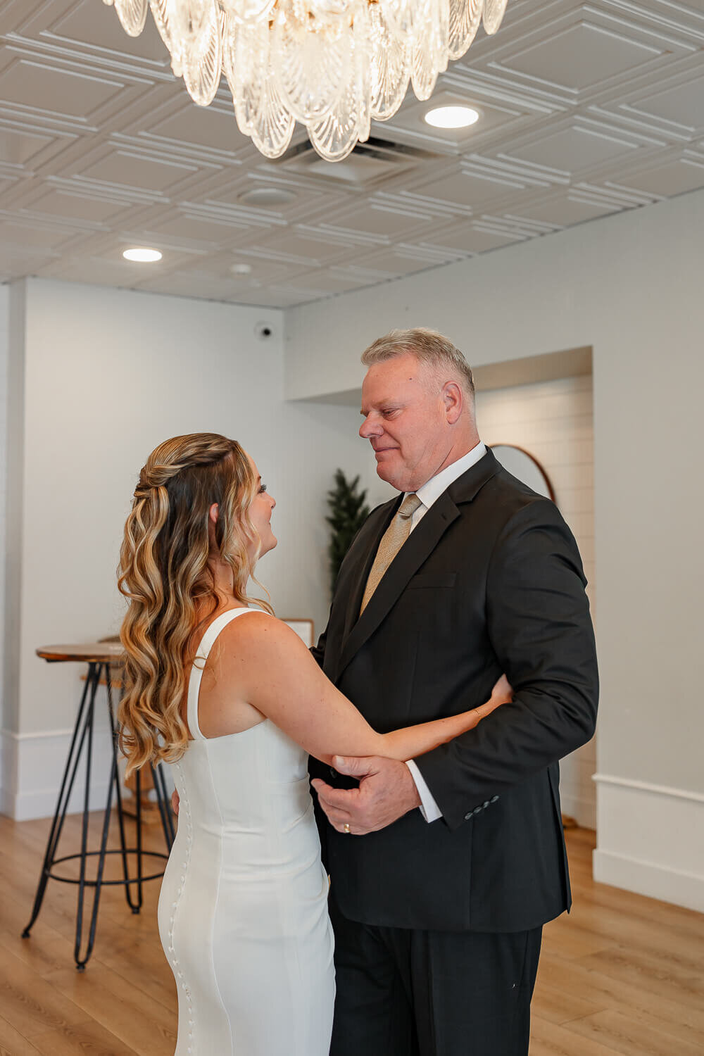 Heartwarming moment between the bride and her father during a wedding in Colorado Springs, captured by Michelle Betz Photography