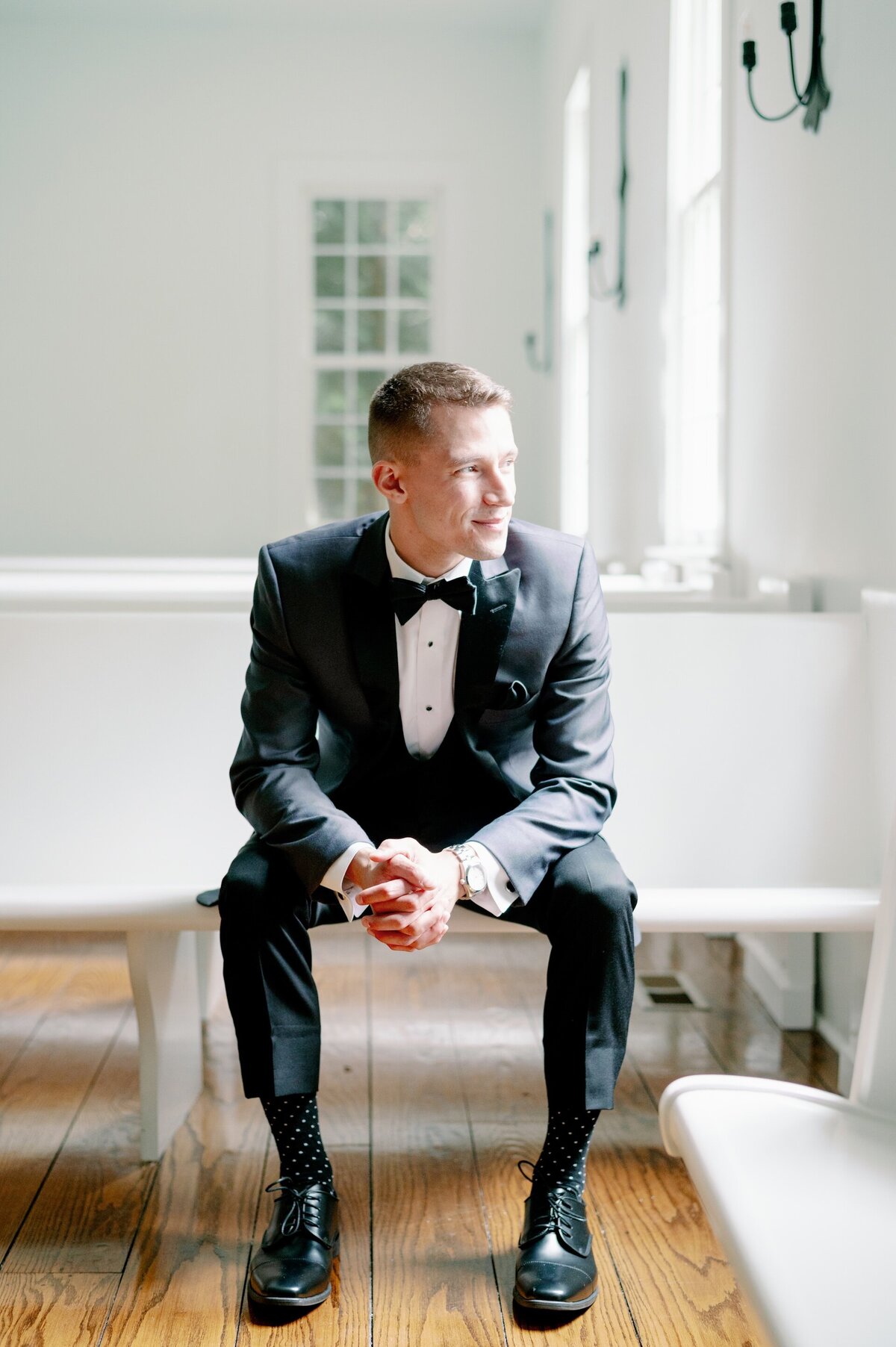 groom sitting in a chapel on his wedding day