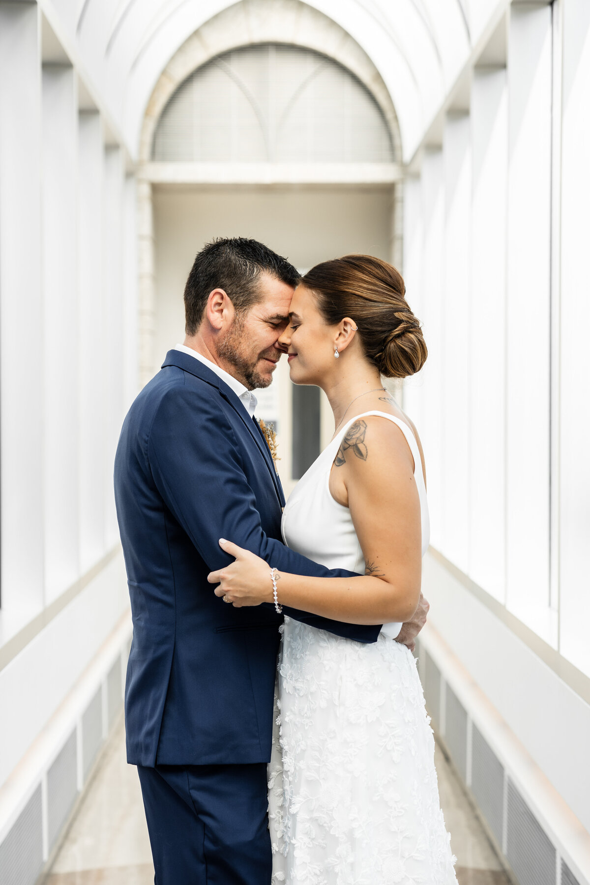 Ottawa city hall elopement, bride and groom embracing each other