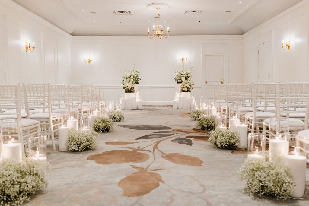 Romantic indoor ballroom wedding ceremony styled by Melissa Alison Events, a genuine and modern wedding planner based in Calgary, Alberta. Featured on the Brontë Bride Vendor Guide.