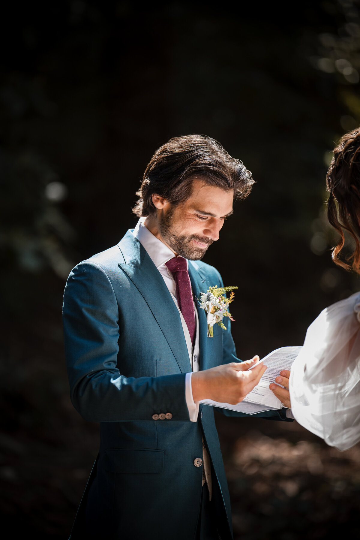A couple shares private vows in the woods at a destination wedding at Nestldown in Los Gatos, California