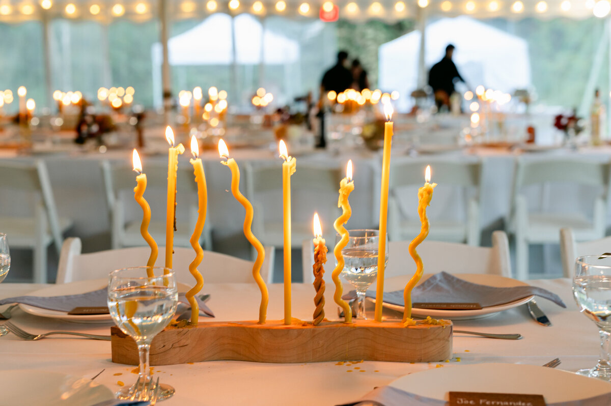 Yellow wavy candles in wedding tablescape