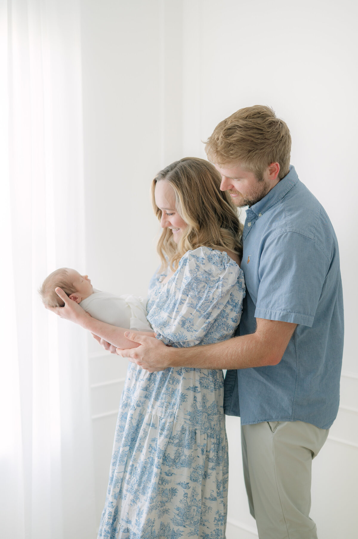 Family with baby by Raleigh newborn and family photographer 