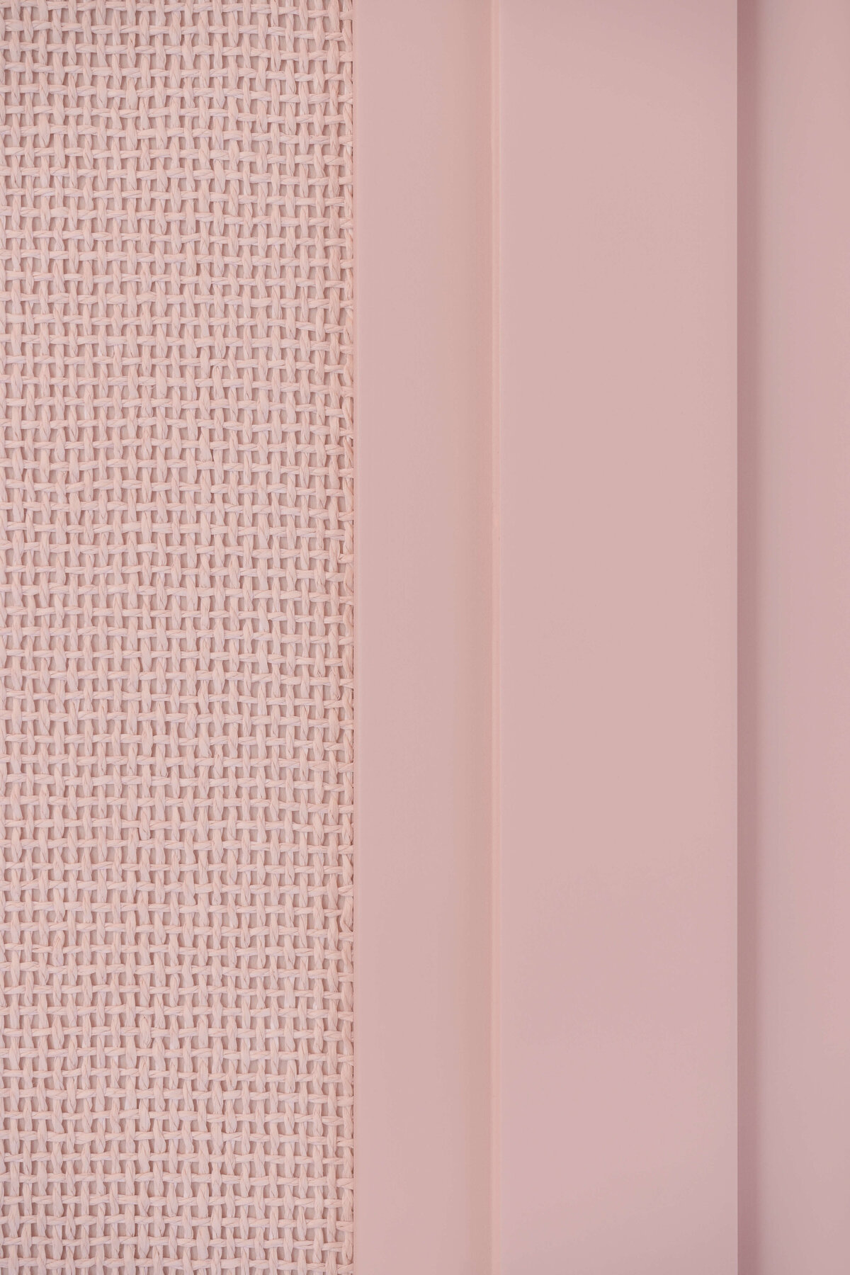 Close look at the pink wall color and wallpaper in girl's bedroom.