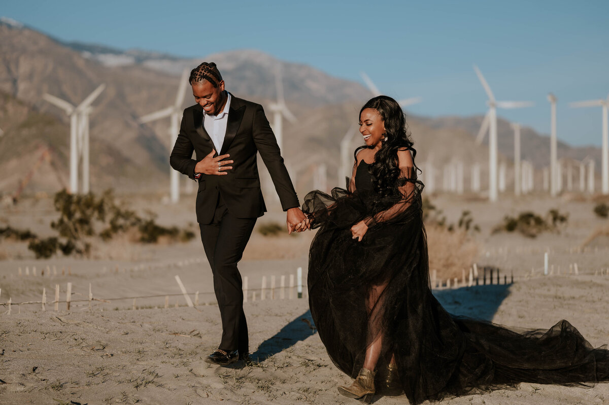 Newly married couple walking. holding hands and smiling during their destination wedding