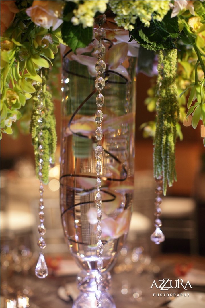 submerged orchids on wire inside crystal vase with crystal strands
