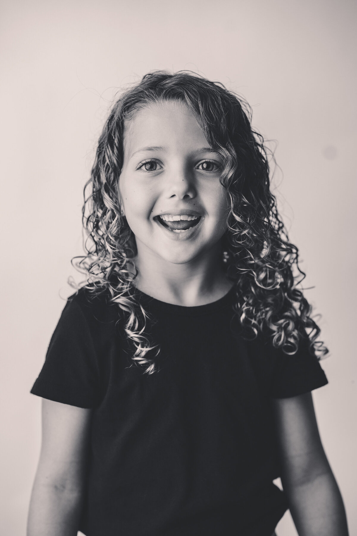 Young girl smiles at the camera during Personality Portrait Photoshoot in Charleston, SC. 