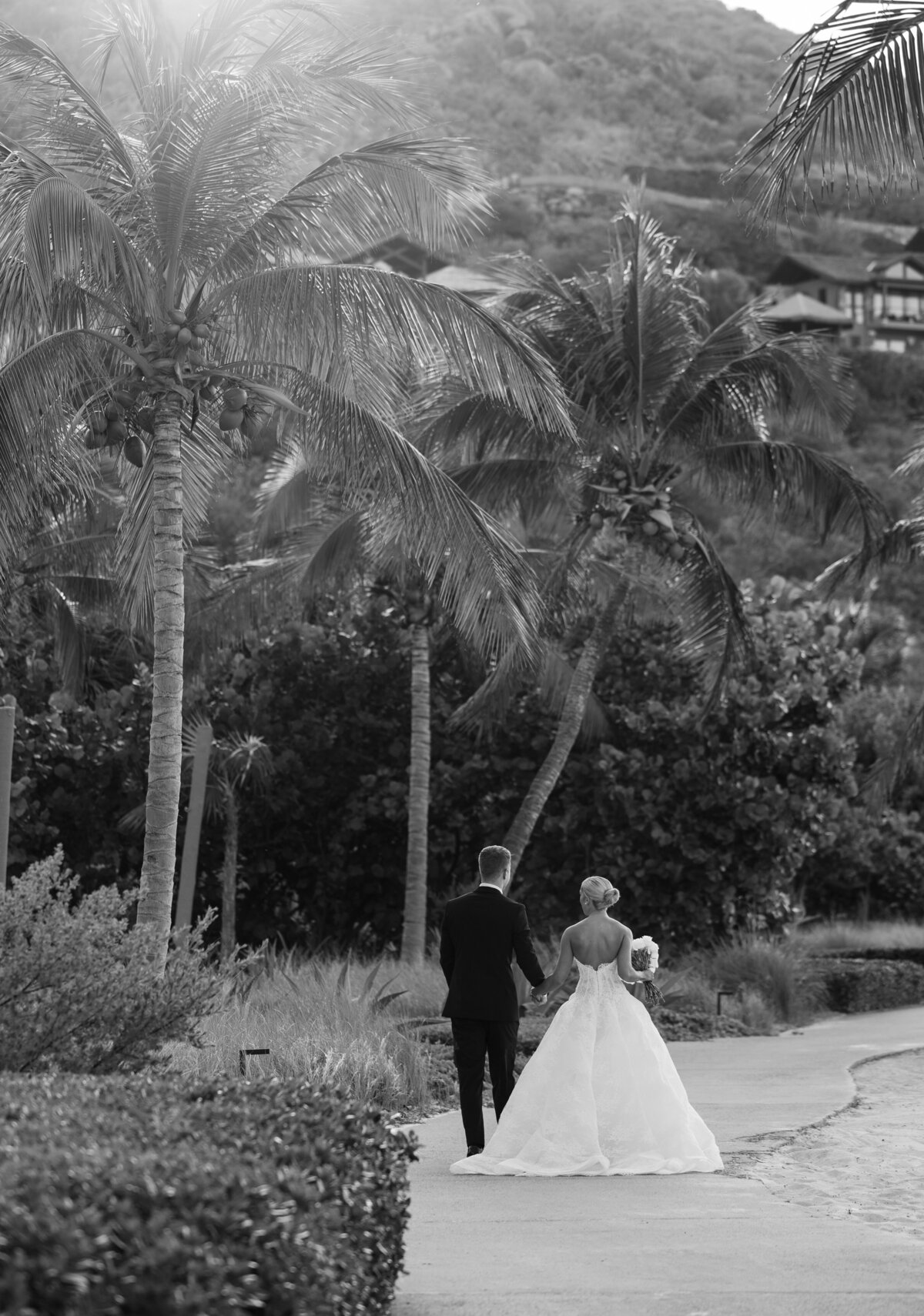 Bride and groom sharing a joyful moment at their luxury destination wedding at BVI Oil Nut Bay