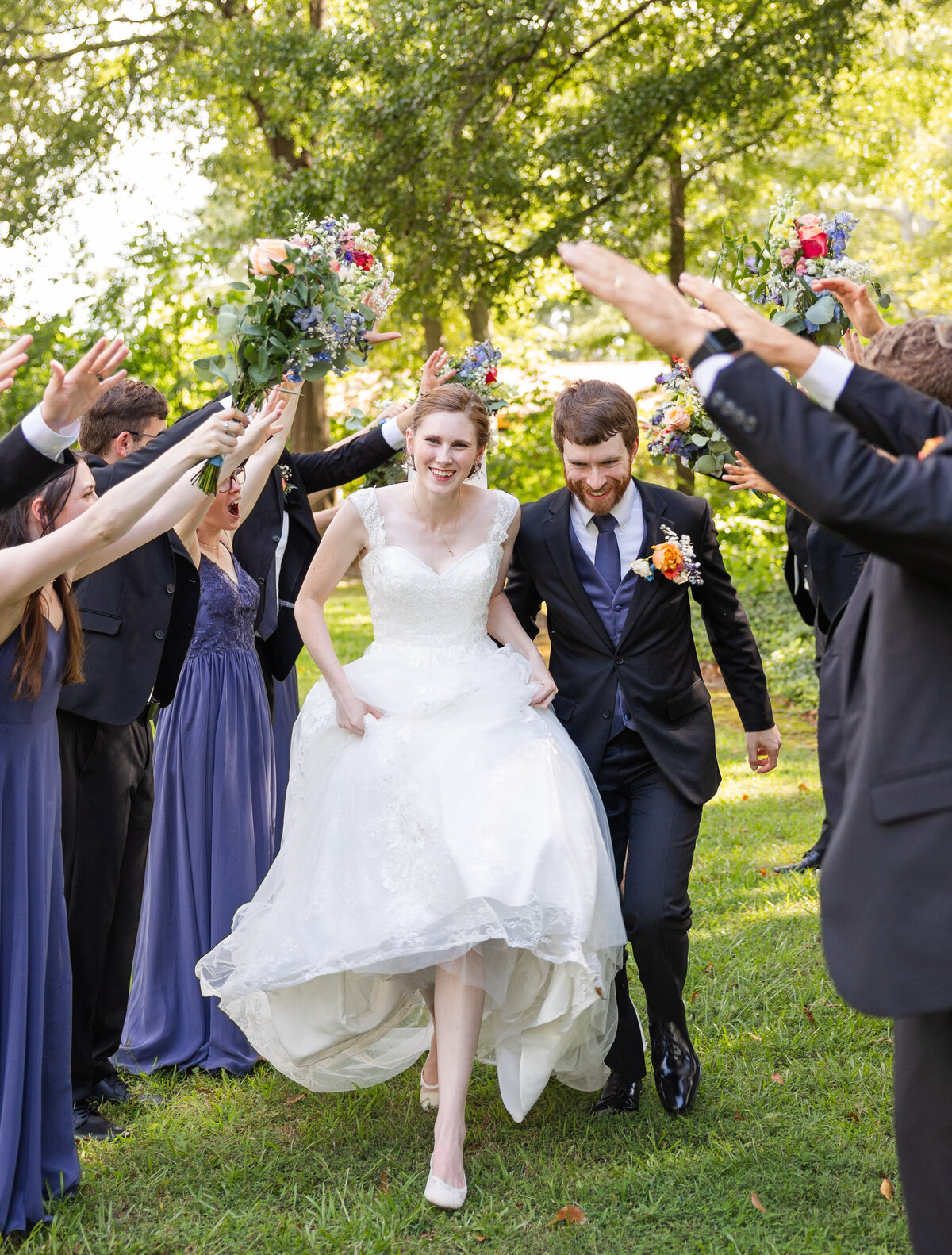 guests celebrating as bride and groom exit wedding