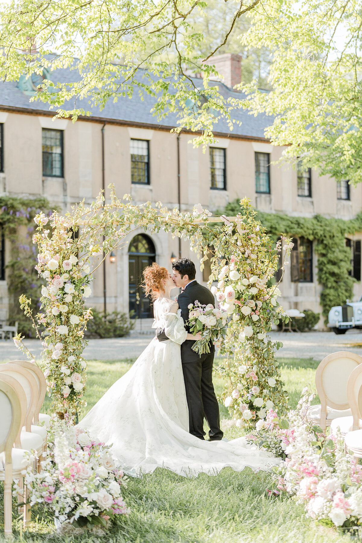 Bride and groom share a kiss at their North Shore Boston wedding ceremony. Captured by best Massachusetts wedding photographer Lia Rose Weddings