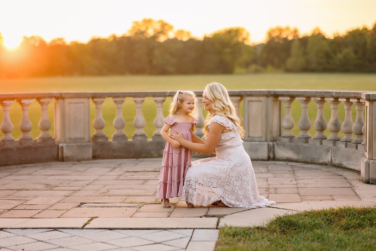 Mom and daughter at sunset