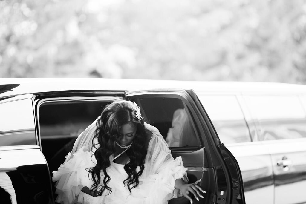 bride getting out of a limousine