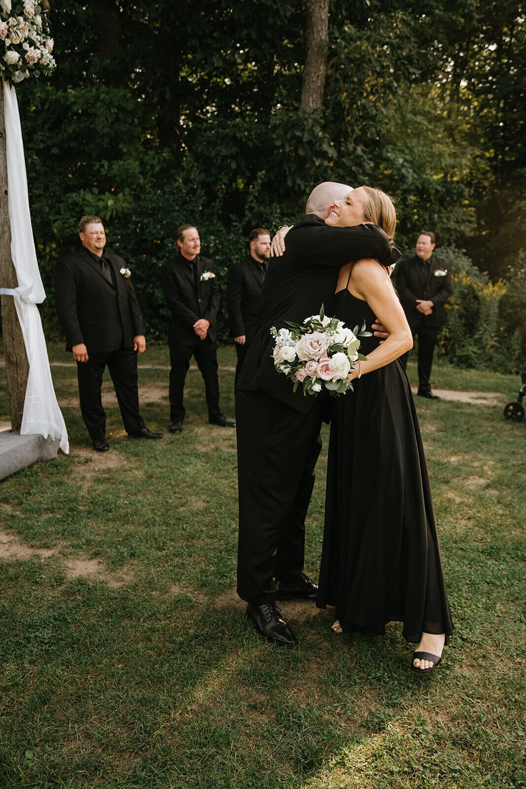 Bridesmaid-hugging-groom