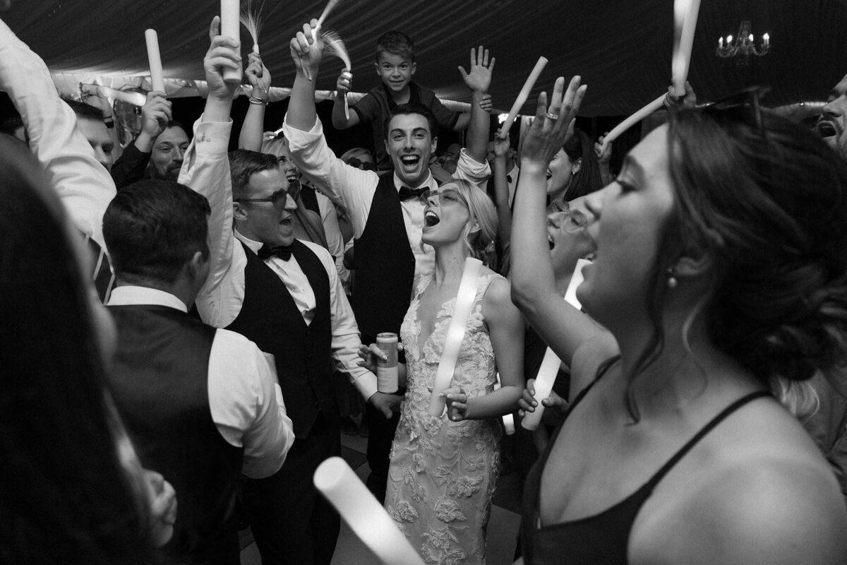 Wedding guests dancing during a reception 